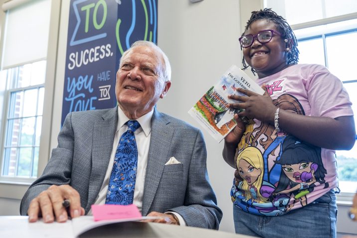 Former Gov. Nathan Deal signing his book.