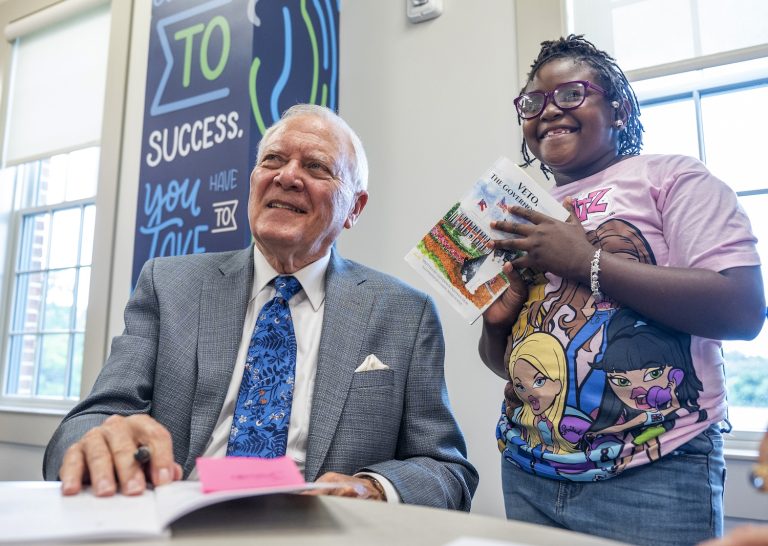 Former Gov. Nathan Deal signing his book.