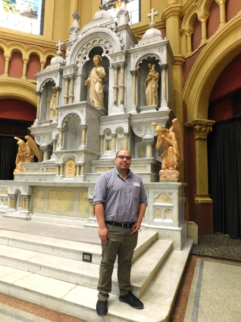 Man standing in a former Catholic Church