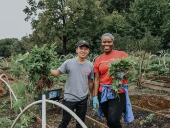 Woman and man standing on a farm.