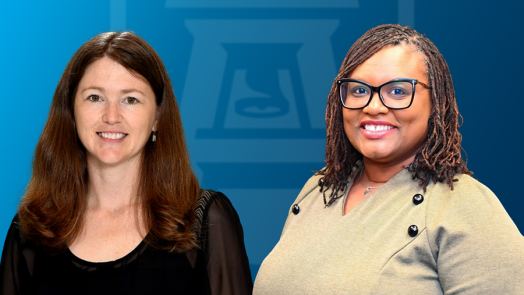 Two women stand side-by-side and smile. There is a logo for Augusta University featuring an AU and bell tower behind them.