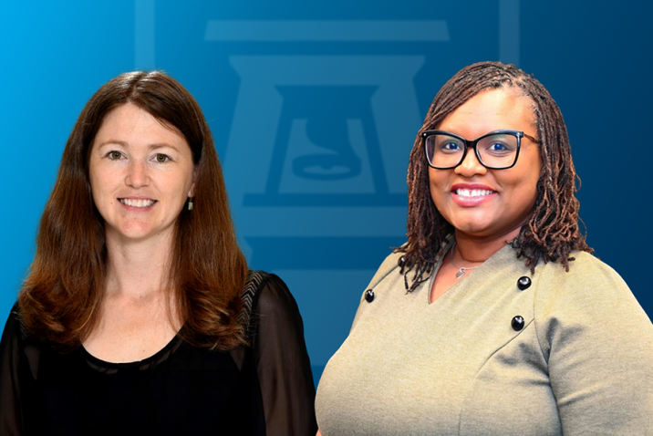 Two women stand side-by-side and smile. There is a logo for Augusta University featuring an AU and bell tower behind them.