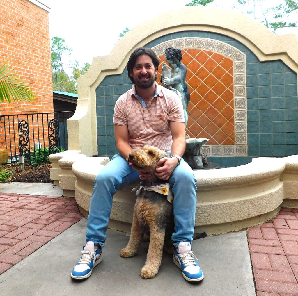 Man sitting with a dog