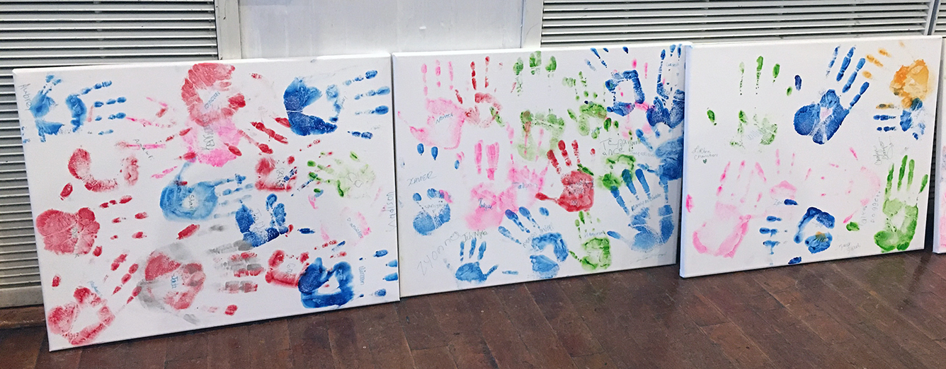 Kids hands prints on posters