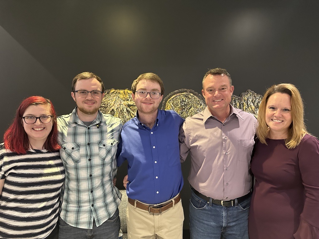 Group of individuals posing together for a photo.