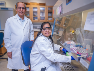 A male and female researcher in a lab.