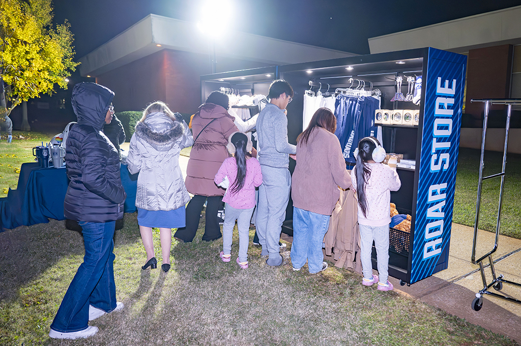 People standing at a mobile store