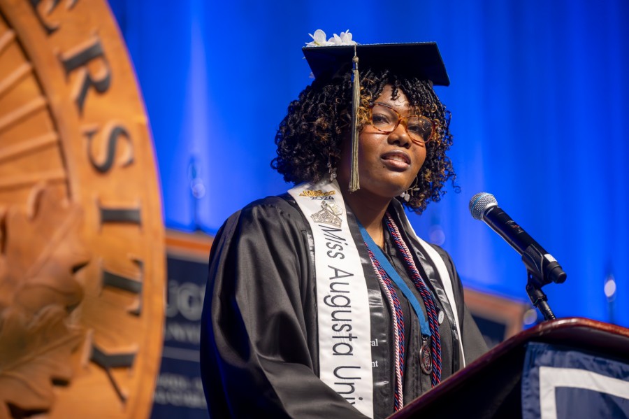 Woman standing at podium.