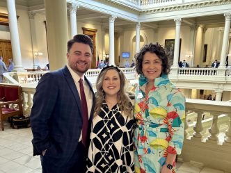 Three people in the Gold Dome in Atlanta