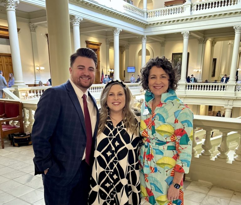 Three people in the Gold Dome in Atlanta