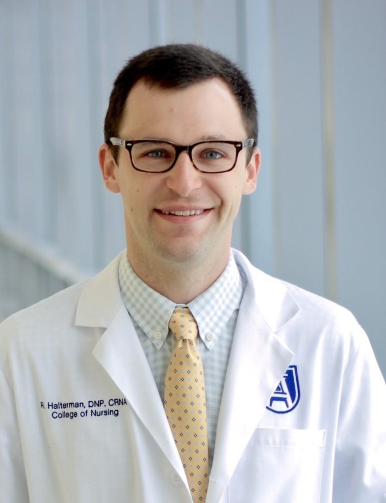 Headshot of Dr. Reed Halterman in a white coat