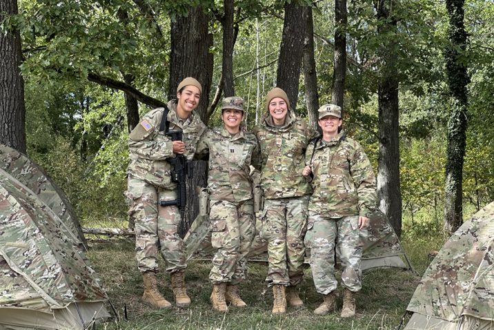 People in Army uniform posing for a photo