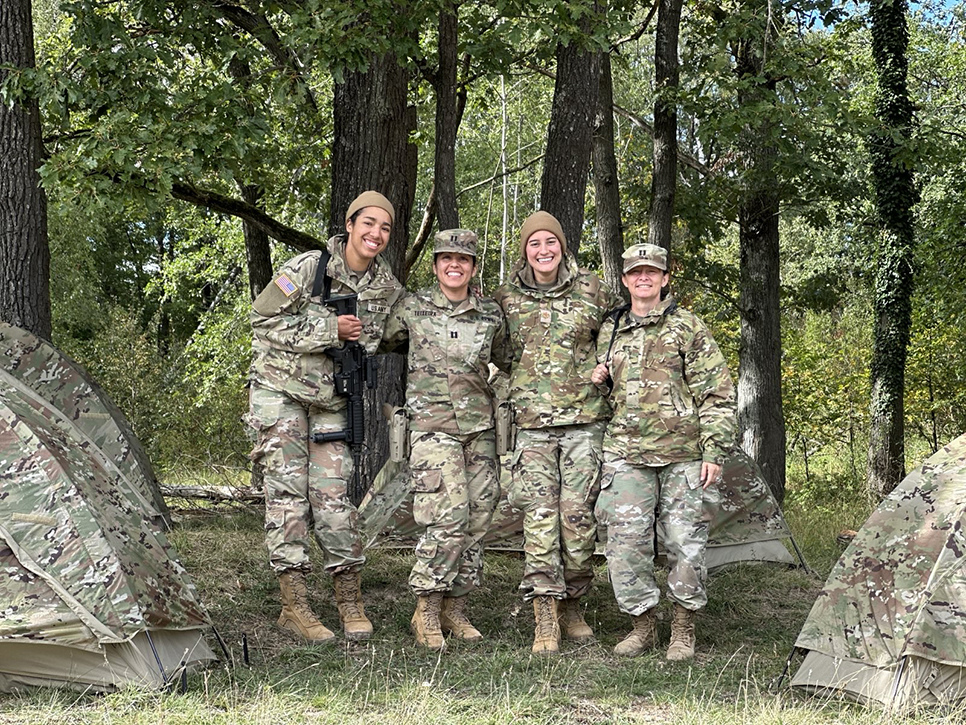 People in Army uniform posing for a photo