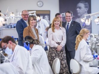 Augusta University president touring the Dental College of Georgia