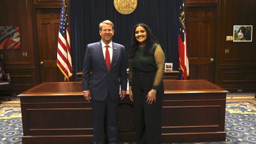 Intern standing with the Georgia governor