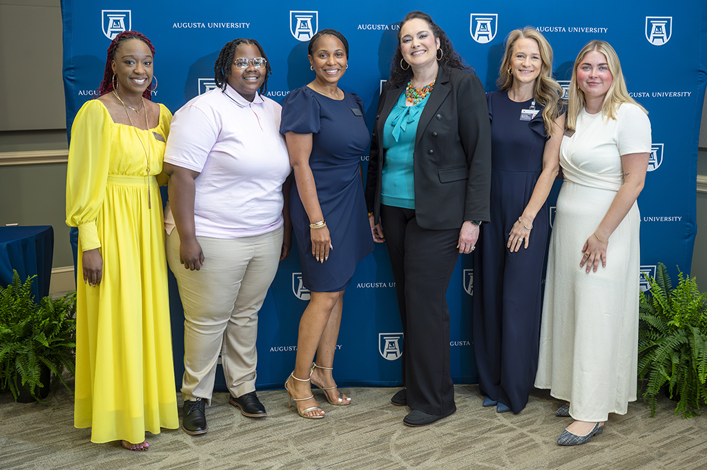 Six woman posing for a photo