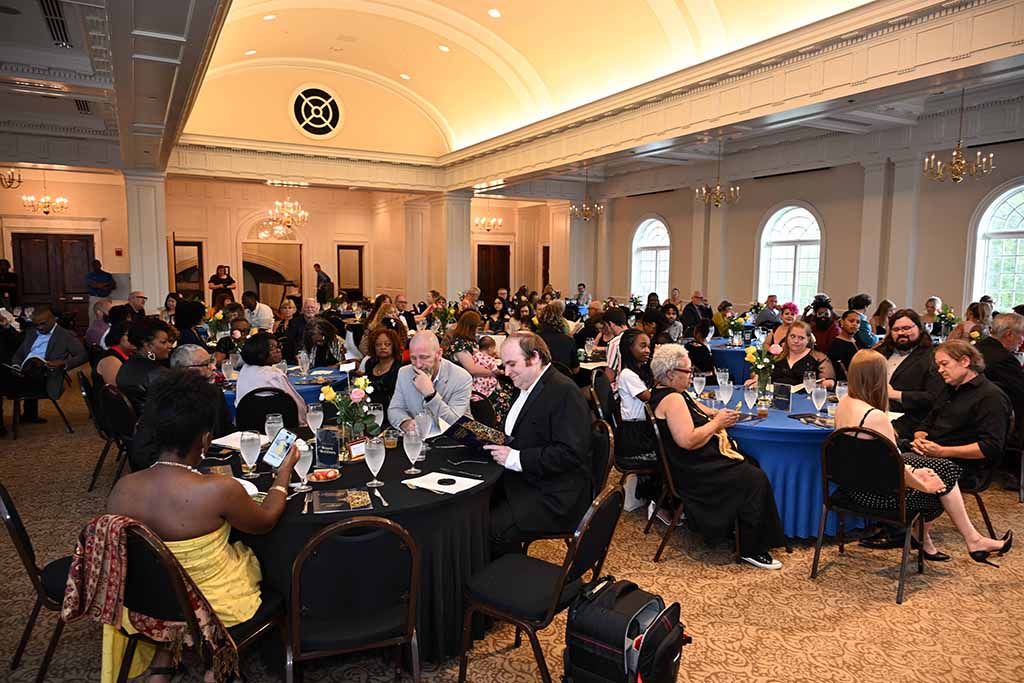 Men and women sitting at tables