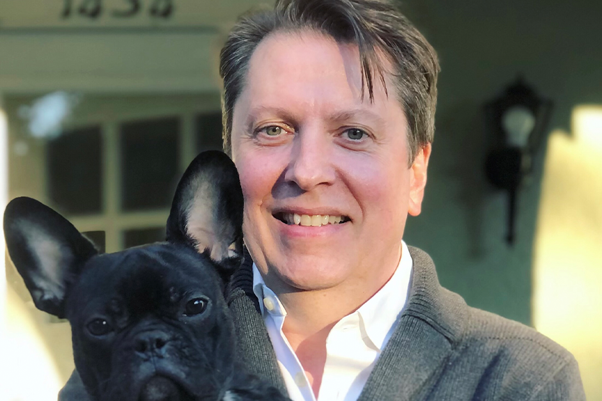 Man smiling with dog