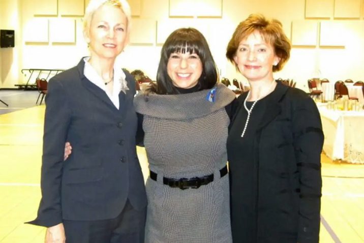 Three women smiling