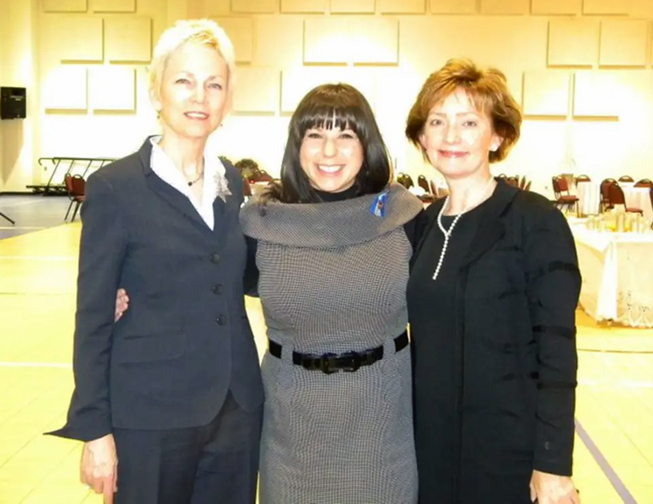 Three women smiling