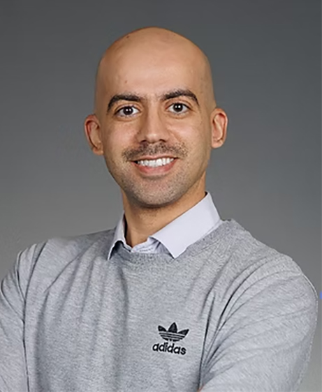 A man wearing a sweater vest.
