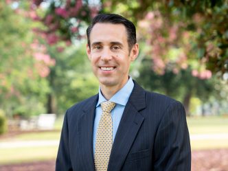 Jeffrey Keenan, the newly named assistant vice president for Student Affairs Facilities for the Division of Enrollment and Student Affairs, standing outside.