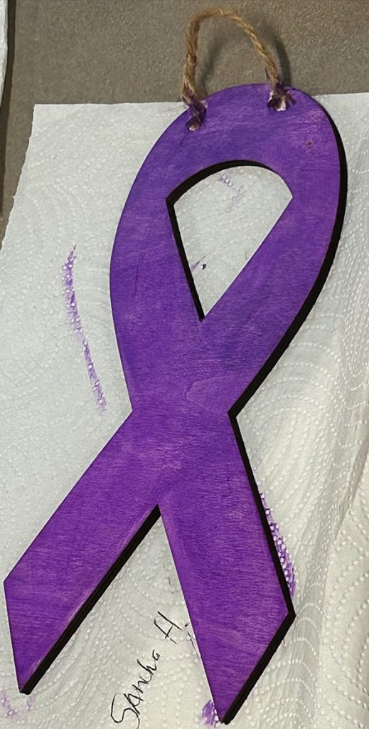 Ribbon made of wood painted purple