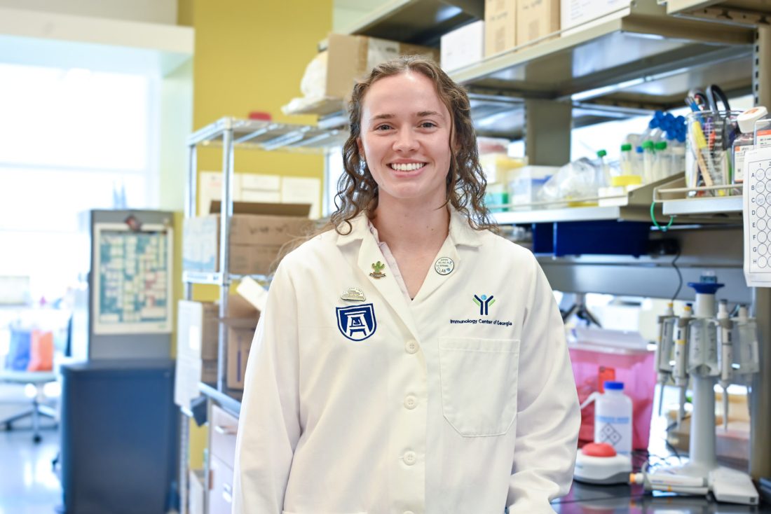 young woman in white lab coat