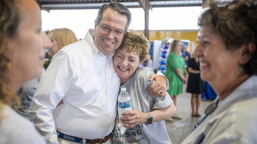 man hugs woman