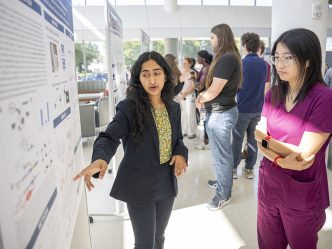 Women talking about poster board projects