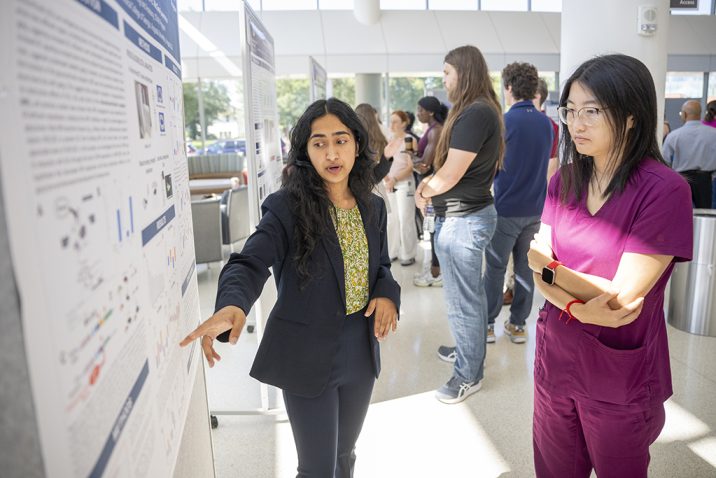 Women talking about poster board projects