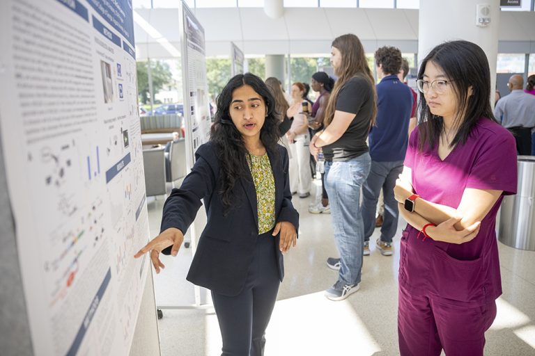 Women talking about poster board projects