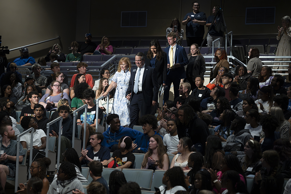 A group of people walking into a theater