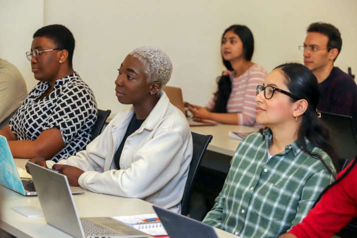 students listening to speakers