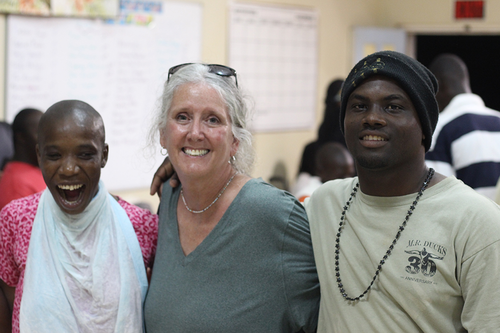 Three people smiling for a photo