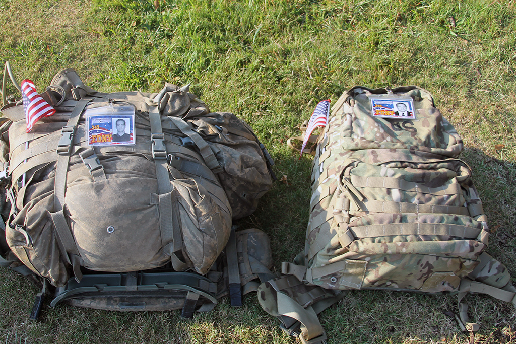 Backpacks sitting on the grass