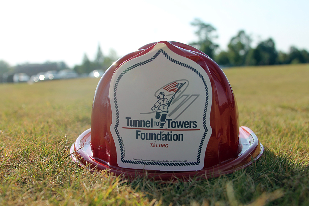 Firefighter toy helmet with the Tunnel to Towers Foundation logo on it