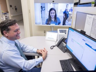 Man looking at a telehealth screen