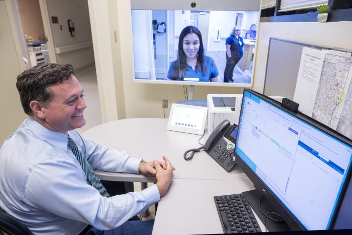 Man looking at a telehealth screen
