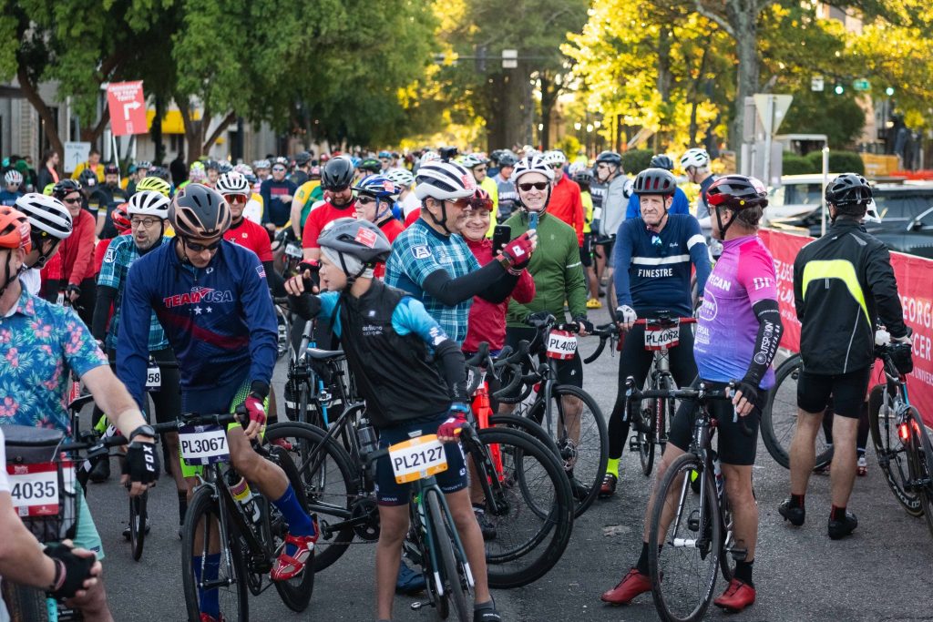 A crowd of people stands in the street at the Starting Line for PaceDay 2023.