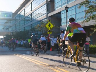This photo shows men and women riding bicycles on a street during Paceday 2023.