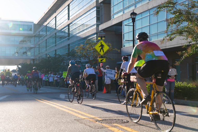 This photo shows men and women riding bicycles on a street during Paceday 2023.
