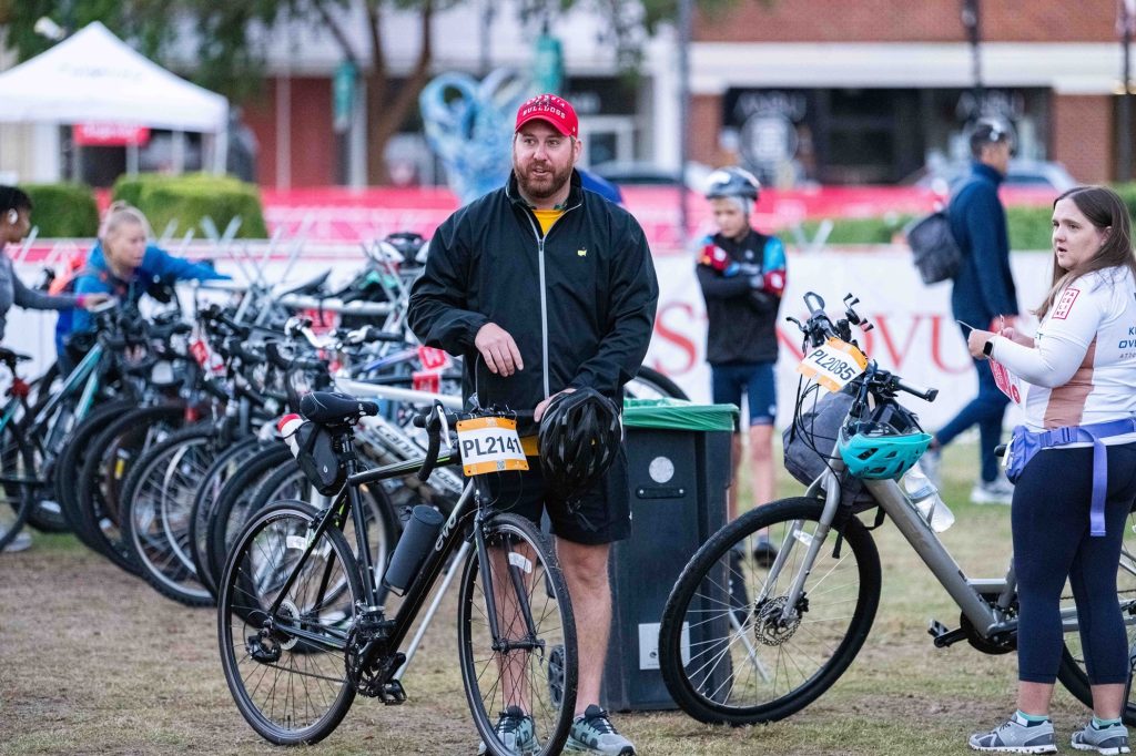 A man repairs a bicycle.