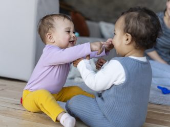 Babies playing with each other