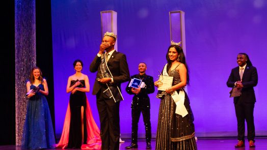 College-aged students on a stage.