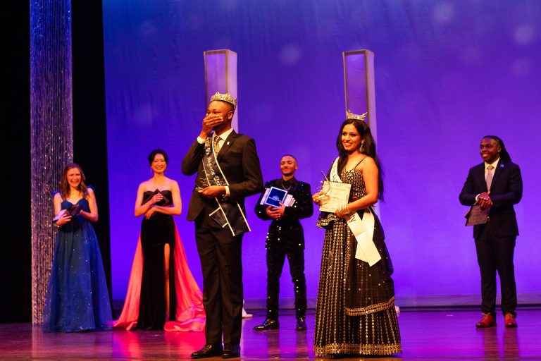 College-aged students on a stage.
