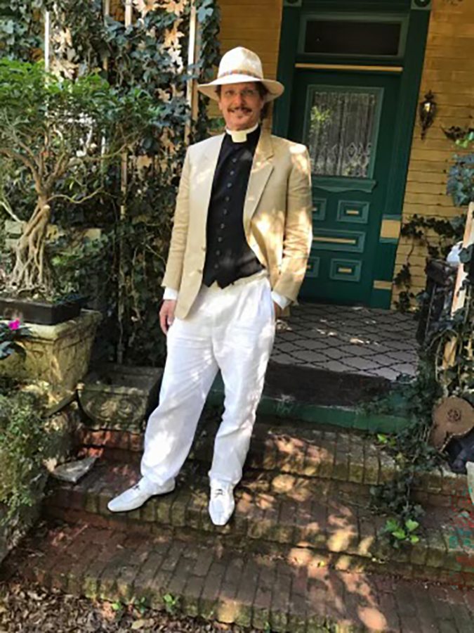Man dressed up standing for a photo