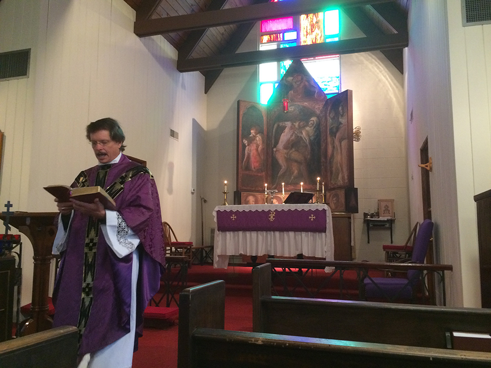 Man in church attire giving a sermon