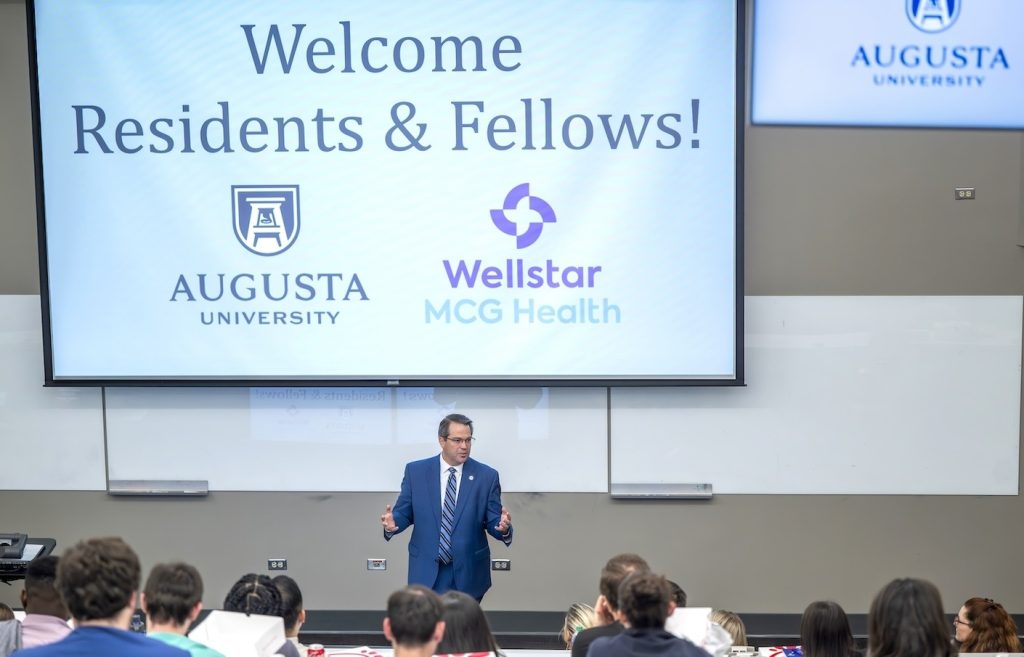 Man talking to medical students