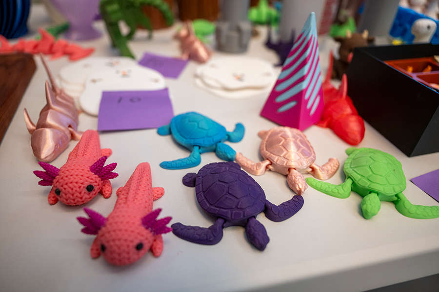 Small figurines, some made of plastic and some that are made of thread.